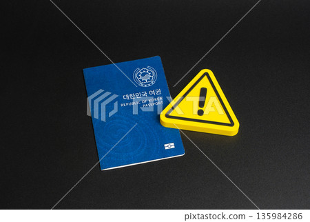 Republic of Korea passport and caution sign. Tightening of rules for obtaining a passport or South Korea citizenship. Changes in legislation and border crossing regulations. Temporary residence permit Republic of Korea passport and caution sign. Tightening of rules for obtaining a passport or South Korea citizenship. Changes in legislation and border crossing regulations. Temporary residence permit 135984286