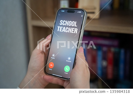 A phone call from a school teacher. Parenting and communication with teachers. Student performance and discipline. Family responsibility, education dialogue 135984318