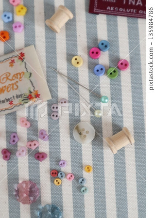Small buttons, pins and tags 135984786