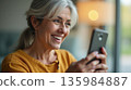happy woman with smartphone at home 135984887