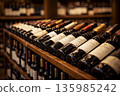 Red wine bottles displayed in a wine shop during a sale event 135985242
