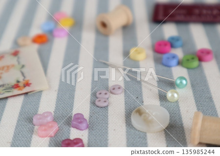 Small buttons, pins and tags 135985244