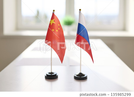 Desk flags of China and Russia on meeting table, symbol of international diplomacy 135985299