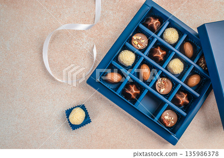 Luxury chocolate gift box with copy space, top view flat lay Luxury chocolate gift box with copy space, top view flat lay 135986378