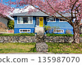 Average single family house with front yard on land terrace. 135987070