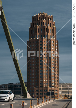 Modern urban architecture with tall brick tower Modern urban architecture with tall brick tower 135987278