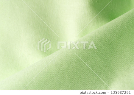 綠色布料，織紋清晰可見。 135987291