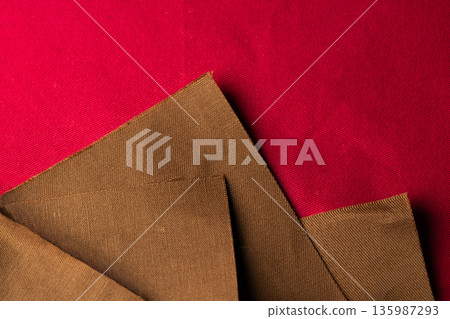 Background material showing the texture of brown and red fabric 135987293