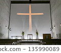 A cross of light appears in the wedding venue 135990089
