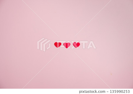 Valentine Day background with red hearts confetti over pink background. St. Valentine's Day love concept, flat lay with copy space Valentine Day background with red hearts confetti over pink background. St. Valentine's Day love concept, flat lay with copy space 135990253