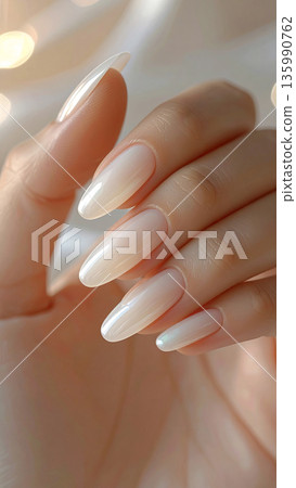 Close-up of sheer, transparent nails and beautifully groomed fingertips | Nail care and hand care 135990762