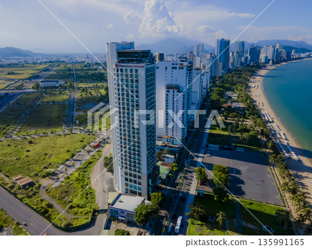 Flying over a coastal city. Flying over a coastal city. 135991165