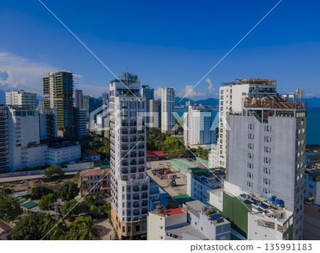 Flying over a coastal city. 135991183