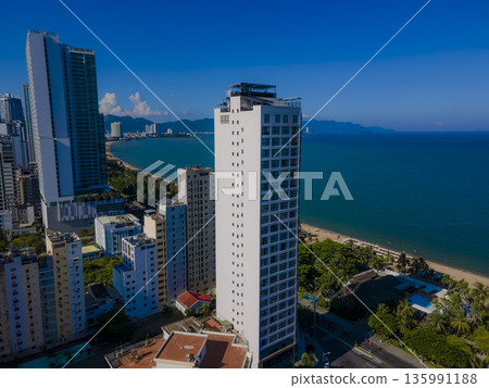 Flying over a coastal city. Flying over a coastal city. 135991188