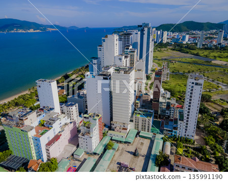 Flying over a coastal city. 135991190