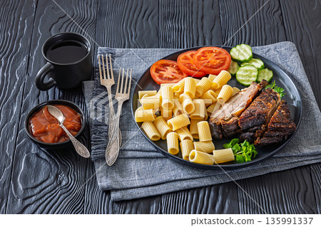roasted pork ribs with pasta and fresh vegetables roasted pork ribs with pasta and fresh vegetables 135991337