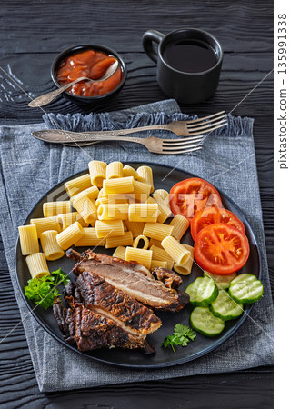 roasted pork ribs with pasta and fresh vegetables roasted pork ribs with pasta and fresh vegetables 135991338