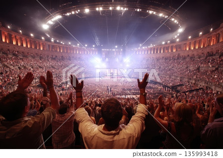 Audience Giving Standing Ovation from Elevated Perspective in Concert Event Hall 135993418