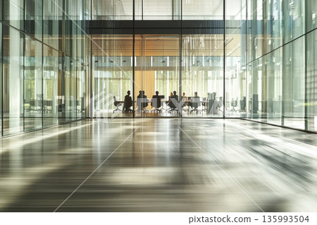Diverse Team Collaboration in Modern Corporate Office Setting with Glass Walls 135993504