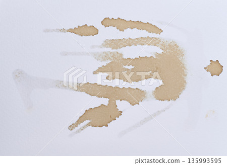 White sheet of cardboard is covered with drops of coffee, brown blots and streaks White sheet of cardboard is covered with drops of coffee, brown blots and streaks 135993595