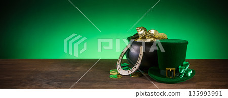 St. Patrick's day pot of gold with leprechaun hat and horseshoe St. Patrick's day pot of gold with leprechaun hat and horseshoe 135993991