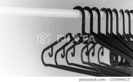 Minimal wardrobe hangers on white rail Minimal wardrobe hangers on white rail 135994017