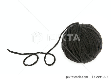 Ball of black wool yarn isolated on white background. 135994025