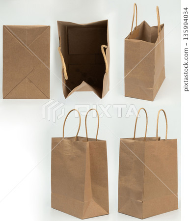 Brown paper bag with handles isolated 135994034