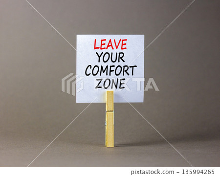 Leave your comfort zone symbol. Concept words Leave your comfort zone on beautiful white paper. Beautiful grey paper background. Business psychological Leave your comfort zone concept. Copy space. Leave your comfort zone symbol. Concept words Leave your comfort zone on beautiful white paper. Beautiful grey paper background. Business psychological Leave your comfort zone concept. Copy space. 135994265