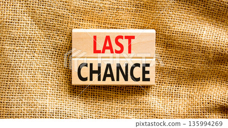 Last chance symbol. Concept word Last chance on beautiful wooden blocks. Beautiful canvas background. Business last chance concept. Copy space. Last chance symbol. Concept word Last chance on beautiful wooden blocks. Beautiful canvas background. Business last chance concept. Copy space. 135994269