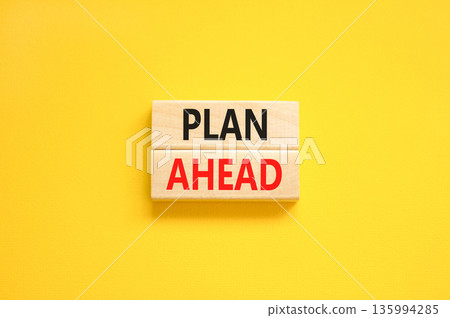 Plan ahead symbol. Concept word Plan ahead on beautiful wooden blocks. Beautiful yellow paper background. Business plan ahead concept. Copy space. Plan ahead symbol. Concept word Plan ahead on beautiful wooden blocks. Beautiful yellow paper background. Business plan ahead concept. Copy space. 135994285