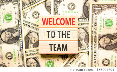 Support, help welcome to the team symbol. Concept words Welcome to the team on beautiful wooden blocks. Beautiful dollar bills background. Business welcome to the team concept. Copy space. Support, help welcome to the team symbol. Concept words Welcome to the team on beautiful wooden blocks. Beautiful dollar bills background. Business welcome to the team concept. Copy space. 135994294
