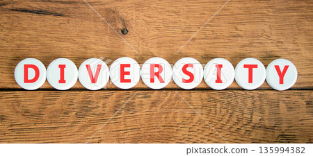 Diversity symbol. Concept words Diversity on beautiful white circles. Beautiful wooden background. Business support diversity DEI concept. Copy space. 135994382