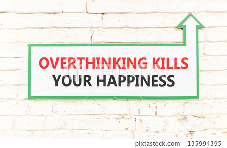 Overthinking kills your happiness symbol. Concept words Overthinking kills your happiness on sign plate. Beautiful brick wall background. Business overthinking kills happiness concept. Copy space. Overthinking kills your happiness symbol. Concept words Overthinking kills your happiness on sign plate. Beautiful brick wall background. Business overthinking kills happiness concept. Copy space. 135994395