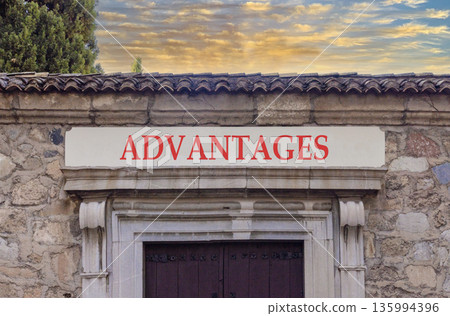 Advantages symbol. Concept word Advantages on beautiful white marble sign plate. Beautiful ancient stone wall and blue sky background. Business advantages concept. Copy space. 135994396