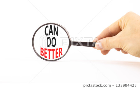 Can do better symbol. Concept words Can do better on beautiful white paper in magnifying glass. Beautiful white paper background. Businessman hand. Business and can do better concept. Copy space. 135994425