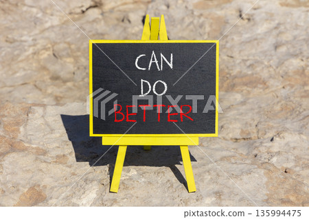 Can do better symbol. Concept words Can do better on beautiful blackboard. Beautiful brown stone beach background. Business and can do better concept. Copy space. 135994475
