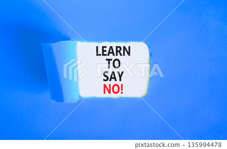 Learn to say no symbol. Concept words phrase Learn to say no on beautiful white paper. Beautiful blue paper background. Business psychological Learn to say no concept. Copy space. 135994478