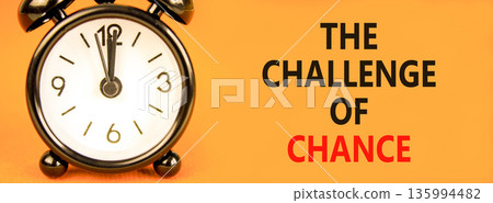 The challenge of chance symbol. Concept words phrase The challenge of chance on beautiful paper. Black alarm clock. Beautiful orange background. Business The challenge of chance concept. Copy space. The challenge of chance symbol. Concept words phrase The challenge of chance on beautiful paper. Black alarm clock. Beautiful orange background. Business The challenge of chance concept. Copy space. 135994482