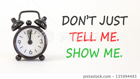 Tell or show symbol. Concept words Do not just tell me, show me on beautiful white paper. Beautiful white paper background. Black alarm clock. Business tell or show concept. Copy space. Tell or show symbol. Concept words Do not just tell me, show me on beautiful white paper. Beautiful white paper background. Black alarm clock. Business tell or show concept. Copy space. 135994483