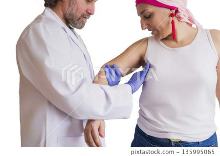 Doctor performing breast examination on woman for cancer detection Doctor performing breast examination on woman for cancer detection 135995065