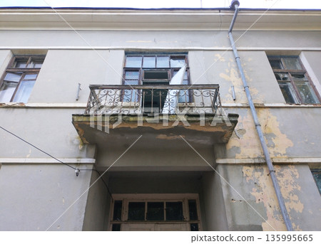 The second-floor balcony is in disrepair 135995665