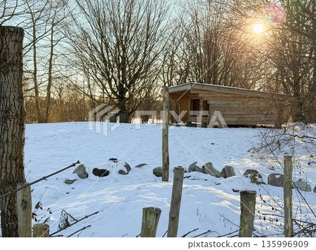 Winter rural landscape with wooden cabin and snow 135996909