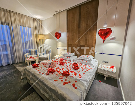 Romantic Room Interior with Decorated Bed Table and Chairs 135997042