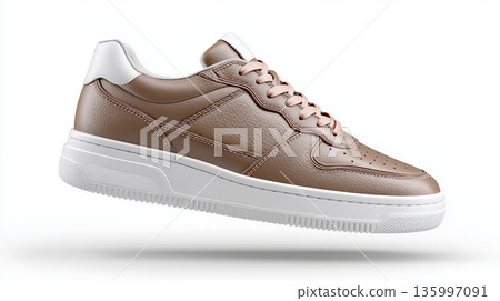 Brown sneaker with white sole shown from side view in neutral background 135997091