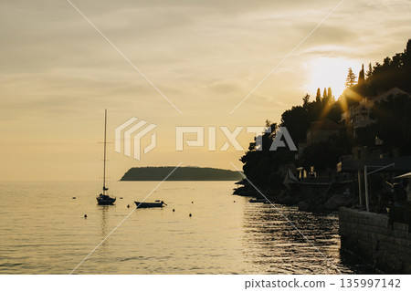 Amazing sunset and the Adriatic sea near Dubrovnik city, Croatia. Travel destination in Croatia. Amazing sunset and the Adriatic sea near Dubrovnik city, Croatia. Travel destination in Croatia. 135997142