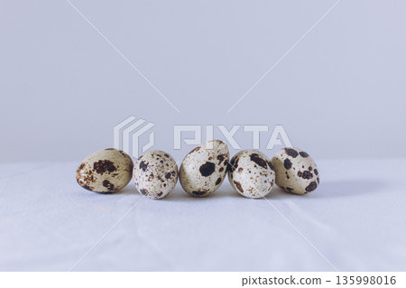 Quail eggs on a white background. Minimal concept. Quail eggs on a white background. Minimal concept. 135998016