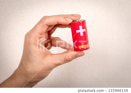 Hand Holding Red Battery Representing Energy And Technology Power 135998139