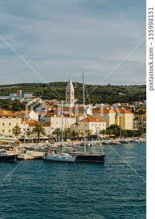 Amazing view of yacht marina and old town Supetar, Brac island, Croatia. Beautiful sunny day. 135998151