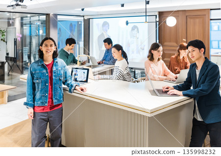 Businessmen and women having a meeting in the office Businessmen and women having a meeting in the office 135998232